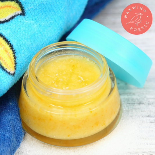 Small clear jar filled with tangering sugar lip scrub
